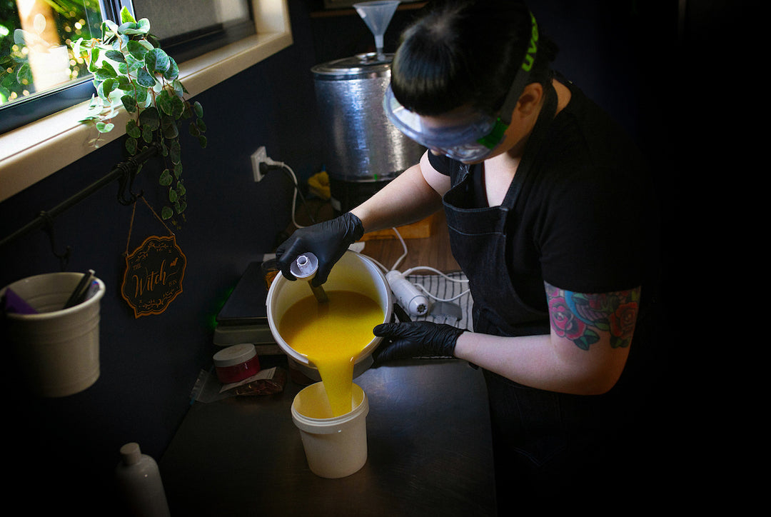 birds eye view of soap being poured into a smaller container at soap cult australia studio