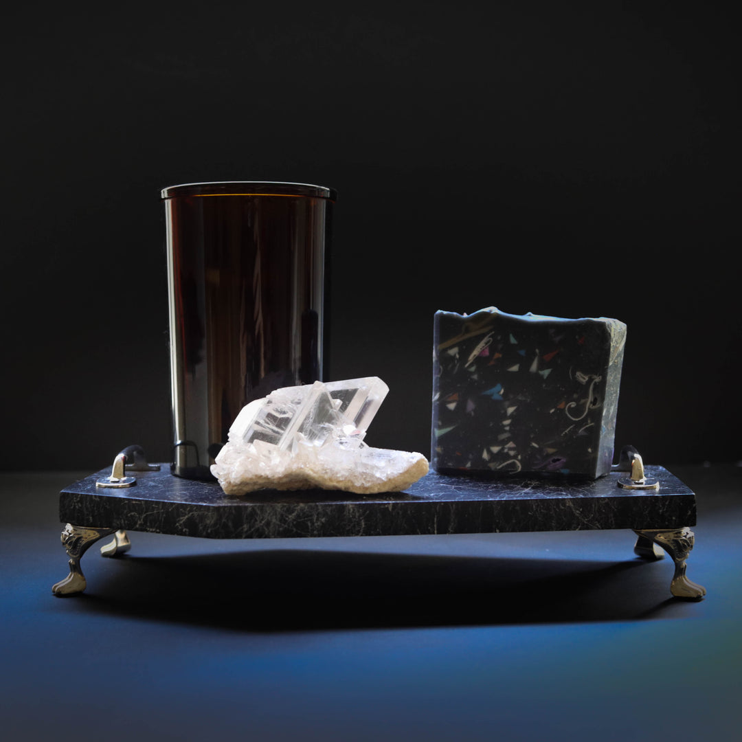 black coffin basin tray with soap crystal and amber glass