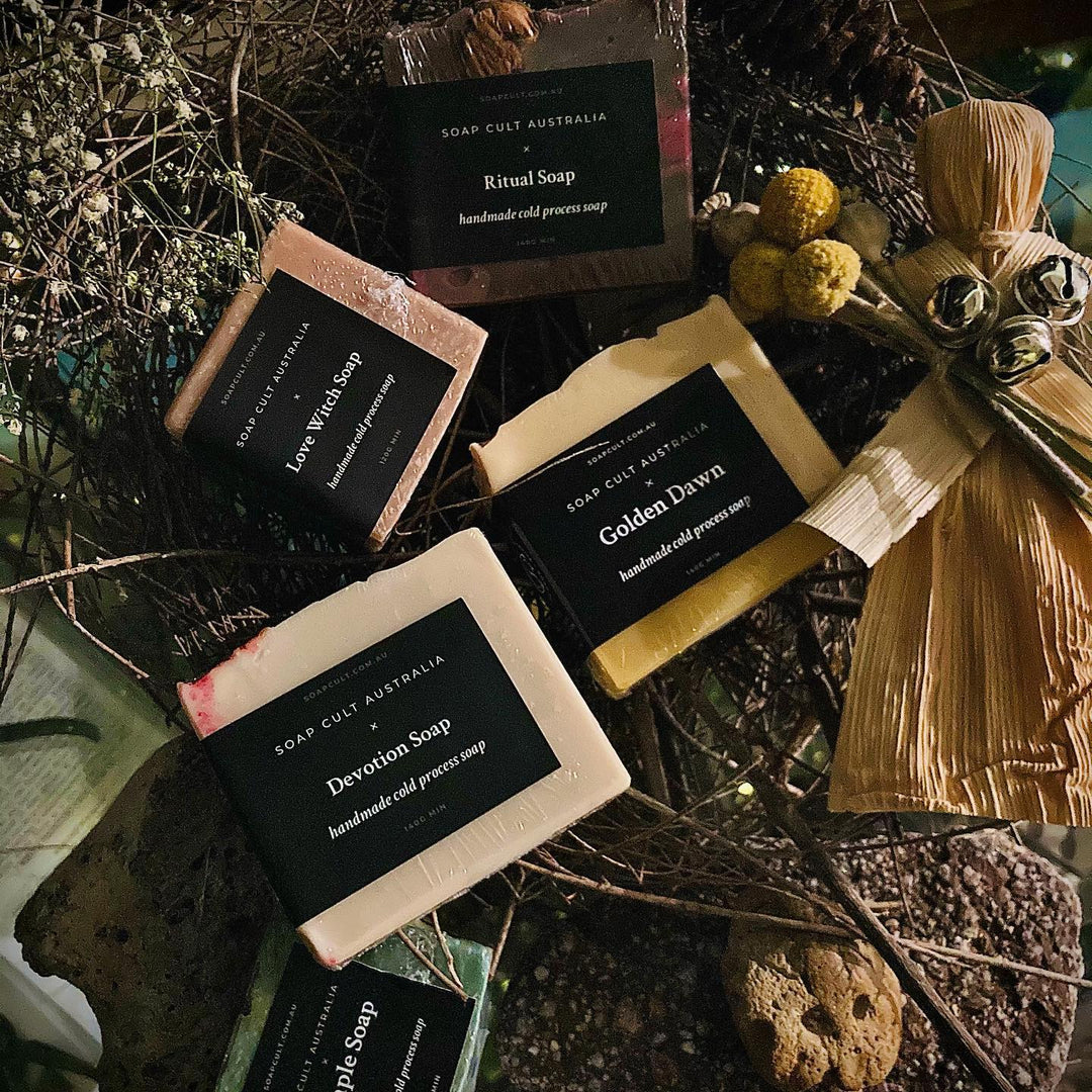 collection of soap cult australia soaps with corn dolly hag stones and other witchy botanicals
