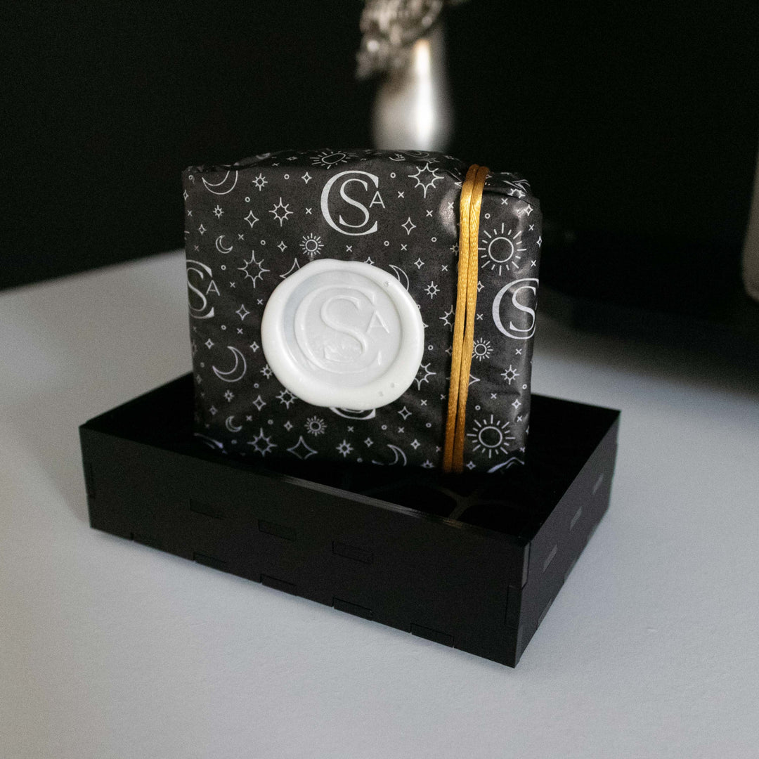 vegan wax seal gift wrap with zodiac tissue paper and gold cord